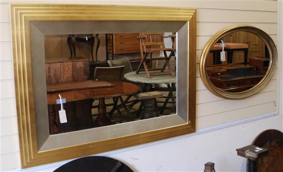 A modern gilt and silvered frame rectangular wall mirror and an oval gilt-framed wall mirror